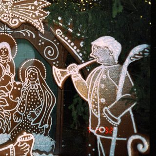 Depiction of Nativity scene with traditional folk art style.