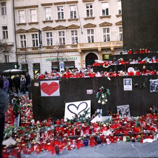 Memorial tribute with candles and flowers.