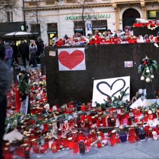 Memorial tribute with candles and flowers.