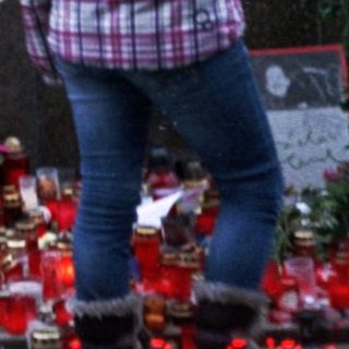 Memorial tribute with candles and flowers.