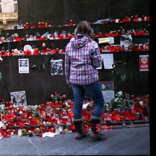 Memorial tribute with candles and flowers.