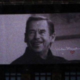Grand building with large portrait projection.