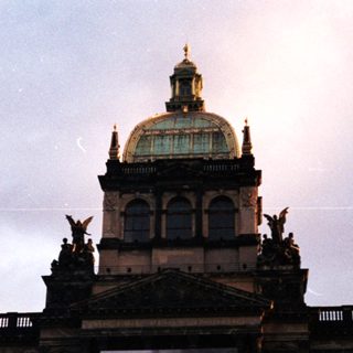 Grand building with large portrait projection.
