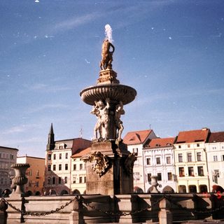 Baroque fountain with statues in historic European square.
