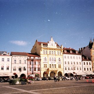 Historic European town square with colorful buildings.