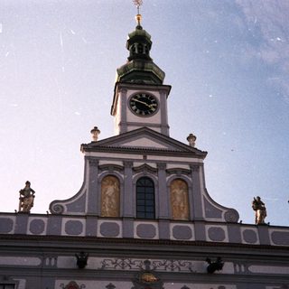 Baroque-style town hall with clock tower.