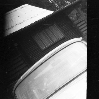 Vintage car with slatted roof.