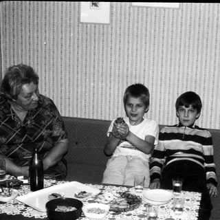 Family gathering at a meal indoors.