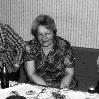 People gathered around a table playing board games.