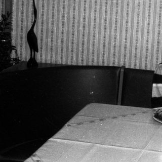 Young boy blowing out birthday candles on cake.