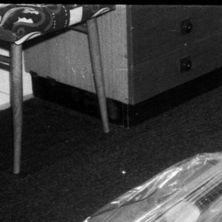Child playing with large plastic bag.