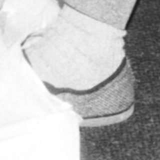 Child playing with large plastic bag.