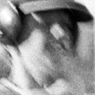 Baseball player swinging bat during practice.