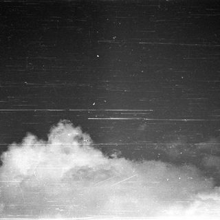 Smoke or vapor against dark background.