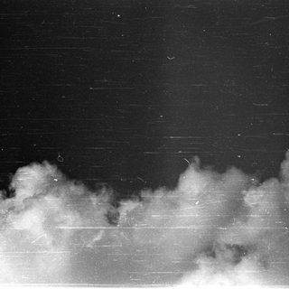 Smoke or fog against dark sky.