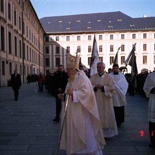 Religious procession with clergy in liturgical vestments.