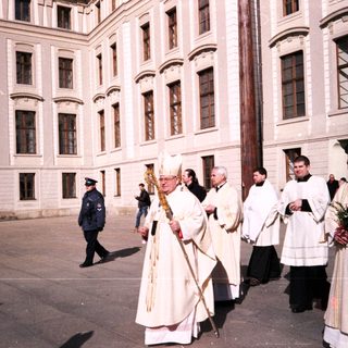 Religious procession with clergy in liturgical vestments.
