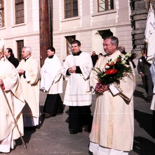 Religious procession with clergy in liturgical vestments.