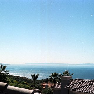 Starry night view of coastal landscape.
