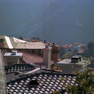 Hilly town with heavy rain and fog.
