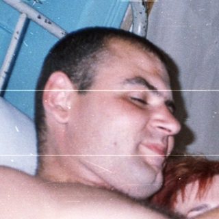 Man and child sleeping together on bunk bed.