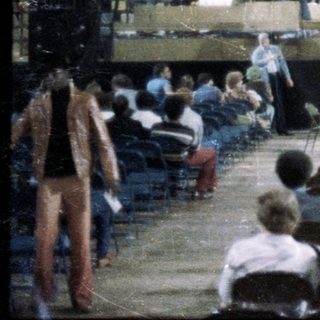 Large indoor arena during a chaotic event.
