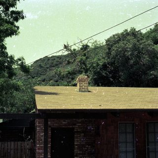 Rural house during heavy rainstorm.