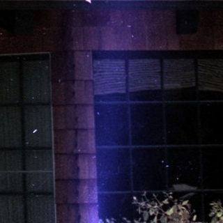 Rural house during heavy rainstorm.