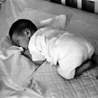 Baby sleeping peacefully on stomach.