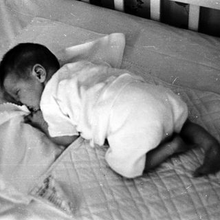Baby sleeping peacefully on stomach.