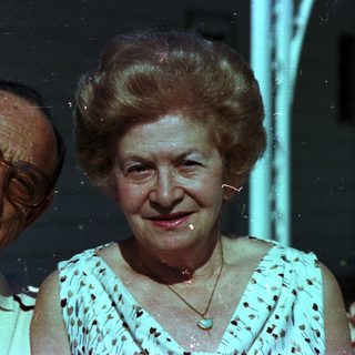 Happy elderly couple posing together indoors.