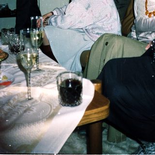 People gathered indoors at a formal event.