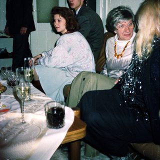 People gathered indoors at a formal event.