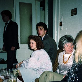 People gathered indoors at a formal event.