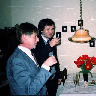Business event with men toasting indoors.