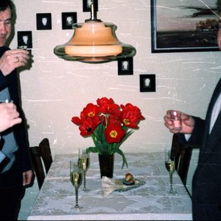 Business event with men toasting indoors.