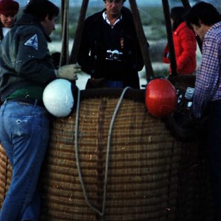 Hot air balloon crew preparing for flight.