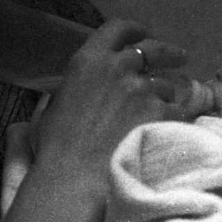 Tender moment of adult comforting sleeping child.