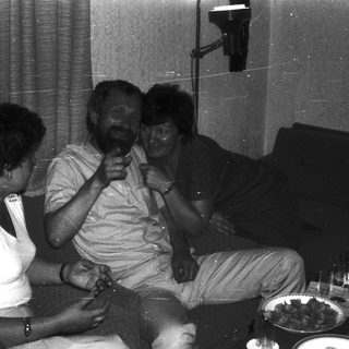 Family enjoying indoor gathering with laughter.