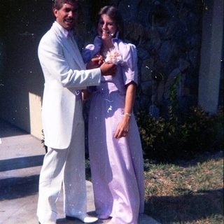 Prom or formal dance couple posing together.