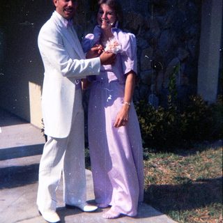 Prom or formal dance couple posing together.