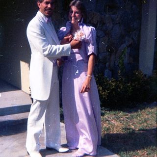 Prom or formal dance couple posing together.