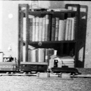 Vintage miniature train set displayed on a table.
