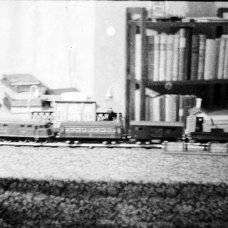 Vintage miniature train set displayed on a table.