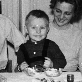 Family gathered around a table for a meal.