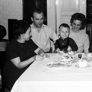 Family gathered around a table for a meal.