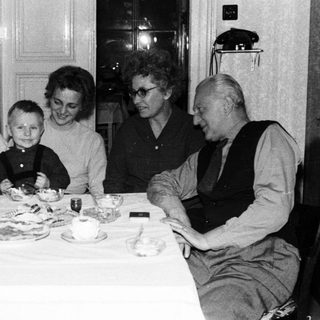 Family gathered around a table for a meal.