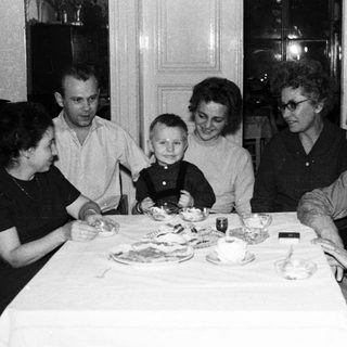Family gathered around a table for a meal.