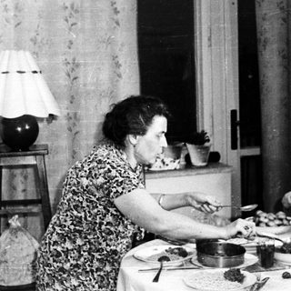 People dining at a table in a vintage home.