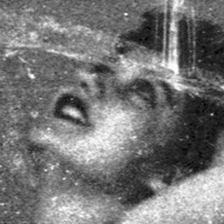 Here's a brief summary of the image: A person appears to be falling or sliding downwards.